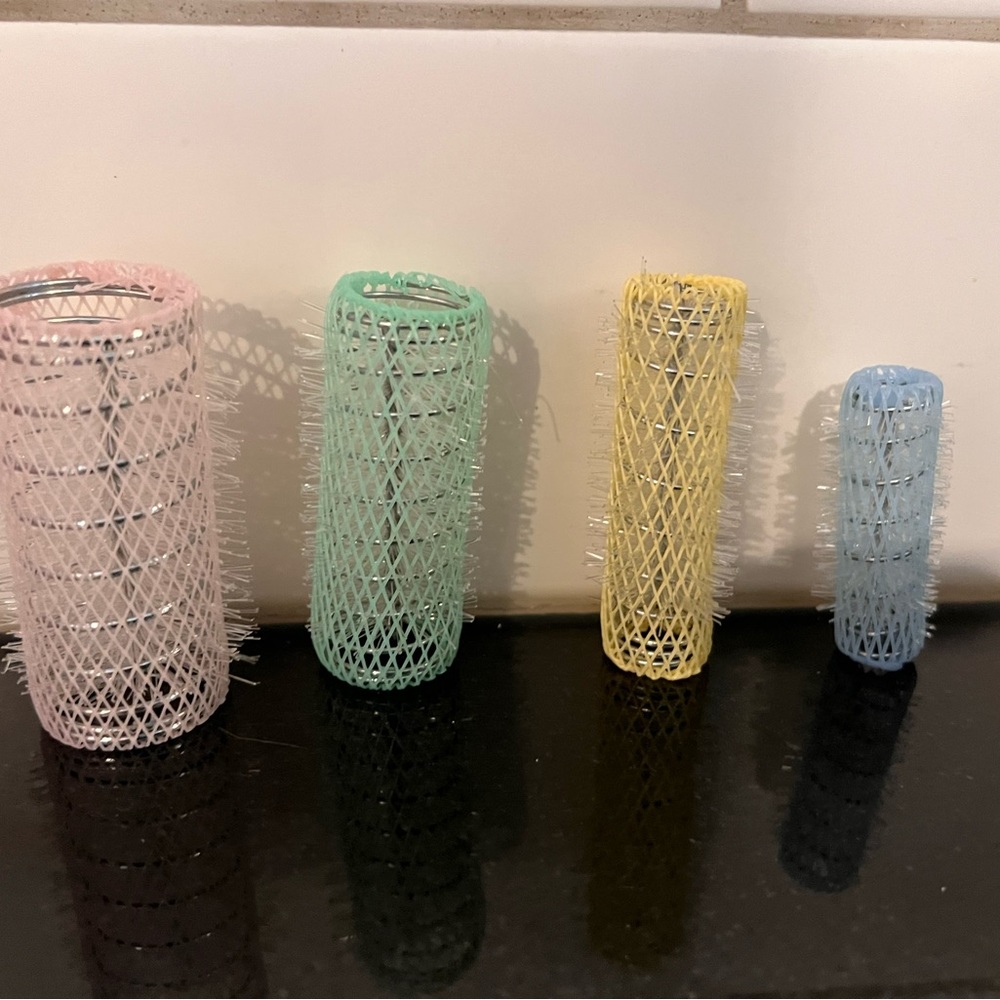 Wire coated hair curlers with inner core.